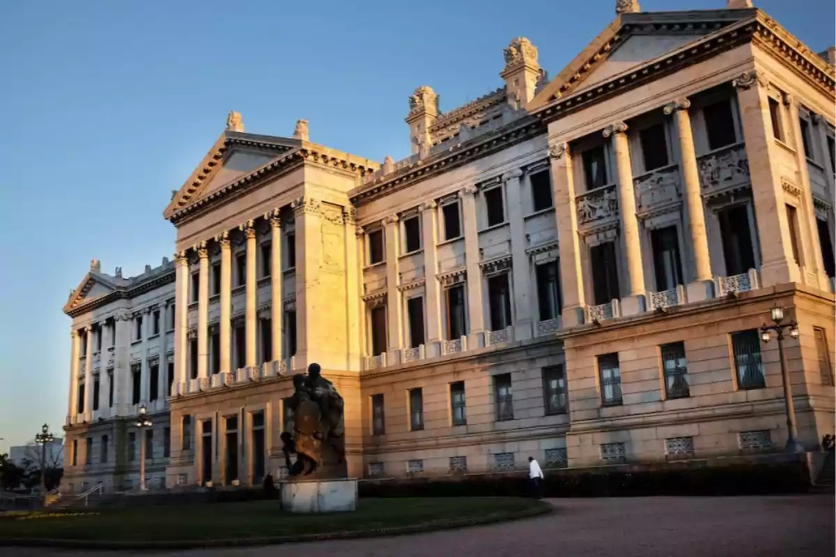 Facade of the Legislative Palace of Montevideo illuminated by the light of the sunset