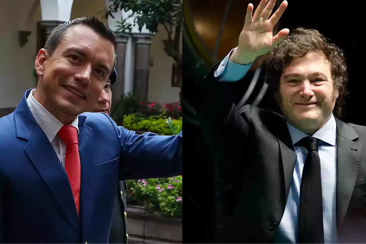 Dos hombres vestidos de traje saludan y sonríen, uno con corbata roja y el otro con corbata negra.