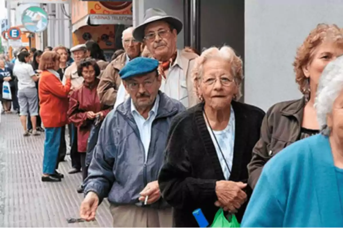 Elderly people standing in line on a city sidewalk