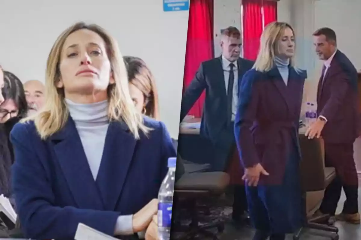 Mujer rubia con abrigo azul en un entorno formal acompañada de varias personas en lo que parece ser una sala de audiencias