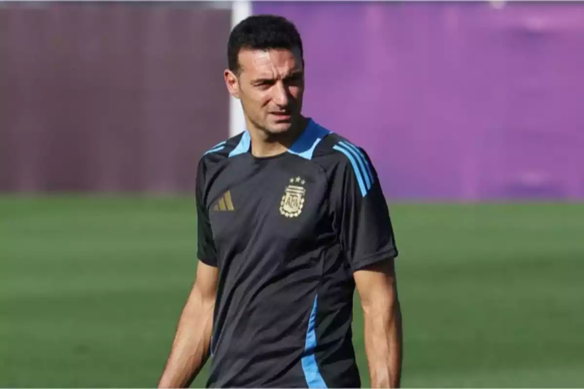 Man wearing an Argentina national soccer team training jersey on a playing field