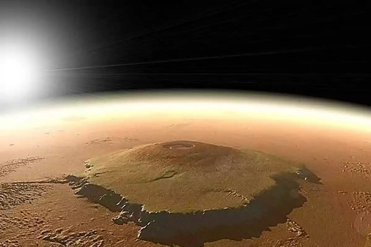 Superficie de Marte con un gran volcán y el Sol brillando en el horizonte del espacio exterior Superficie de Marte con un gran volcán y el Sol brillando en el horizonte del espacio exterior