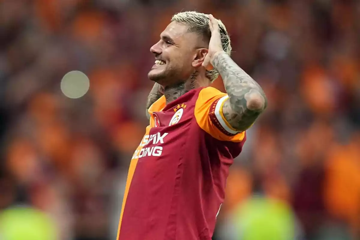 Soccer player in a red and yellow uniform celebrating in a stadium full of fans Soccer player in a red and yellow uniform celebrating in a stadium full of fans