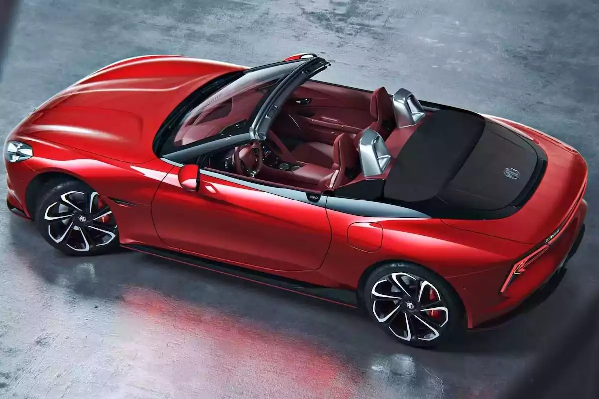 Red convertible sports car with luxury interior and open top seen from above in an urban setting Red convertible sports car with luxury interior and open top seen from above in an urban setting