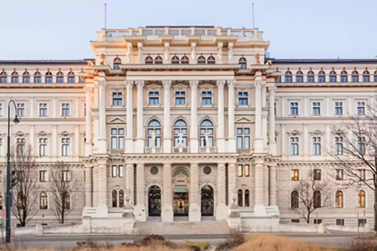 Facade of a historic building in classical style with columns and symmetrical windows