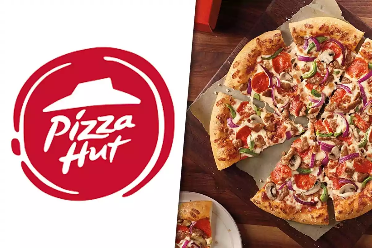 Pizza Hut logo next to a pizza with vegetables, pepperoni, and meat on a wooden table