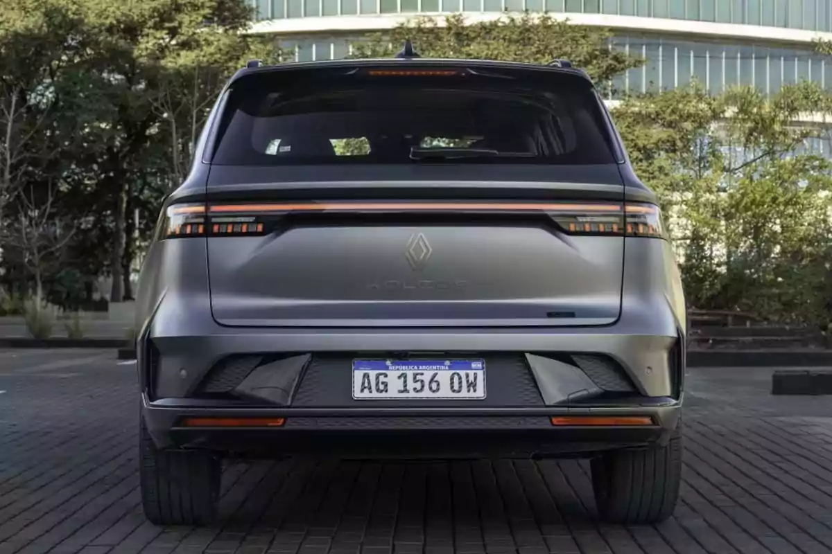 Rear view of a gray Renault Koleos SUV parked in an urban setting Rear view of a gray Renault Koleos SUV parked in an urban setting