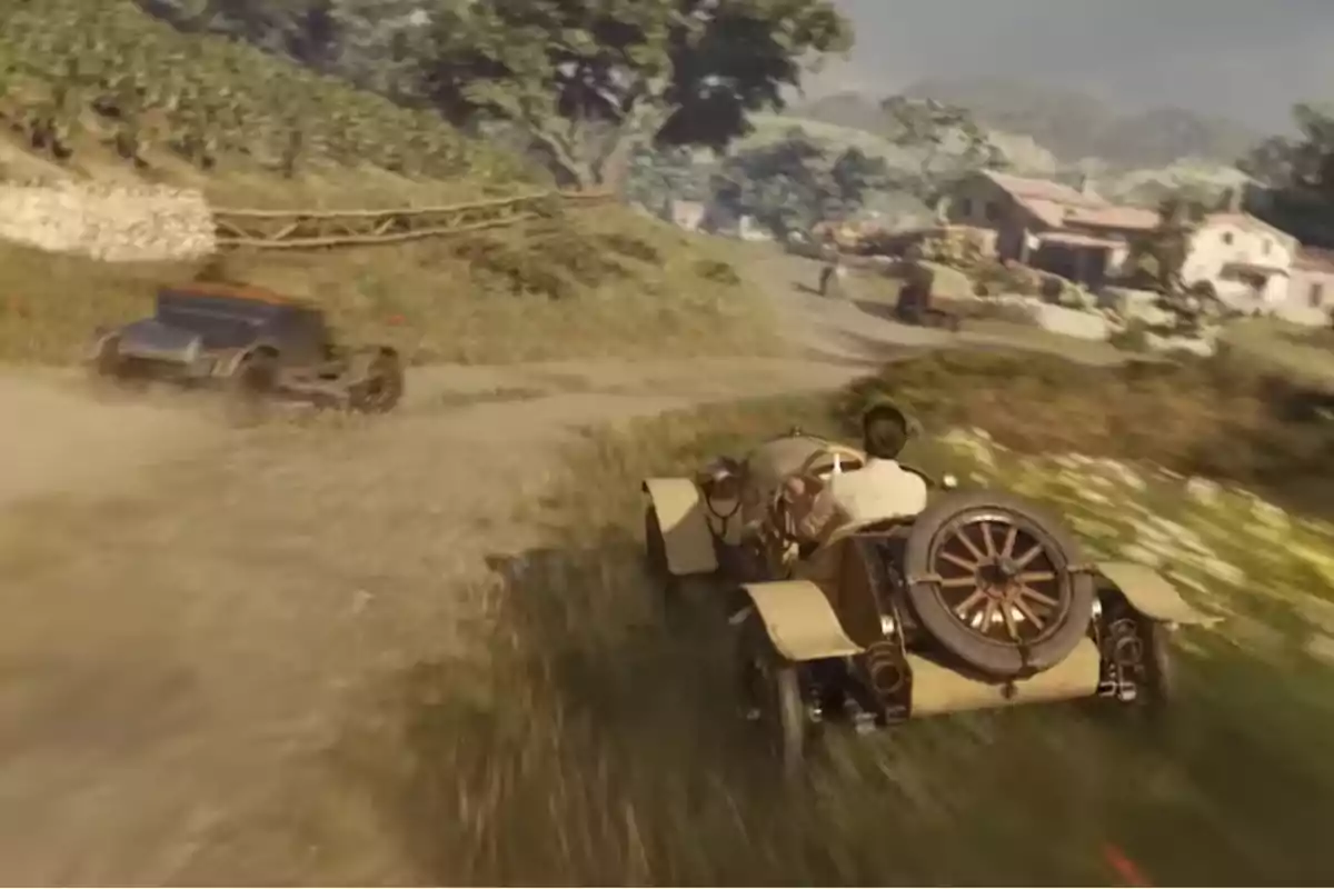 Two vintage cars race down a dirt road surrounded by vegetation and houses in the background in a rural setting. Two vintage cars race down a dirt road surrounded by vegetation and houses in the background in a rural setting.