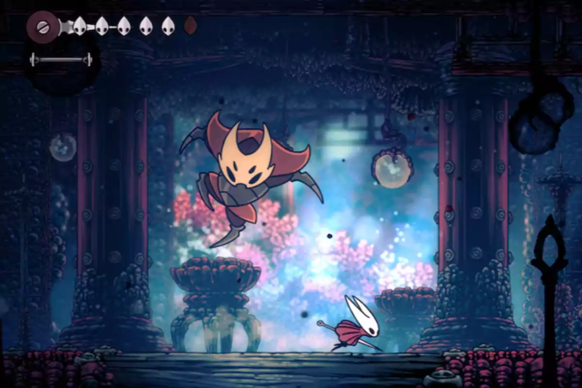 Two insectoid characters fight in a colorful and detailed underground environment from the video game Hollow Knight. Two insectoid characters fight in a colorful and detailed underground environment from the video game Hollow Knight.