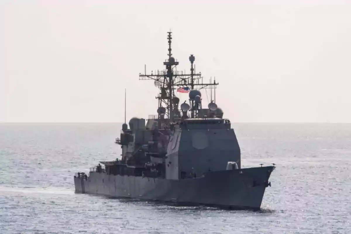 Warship sailing on the sea under a clear sky