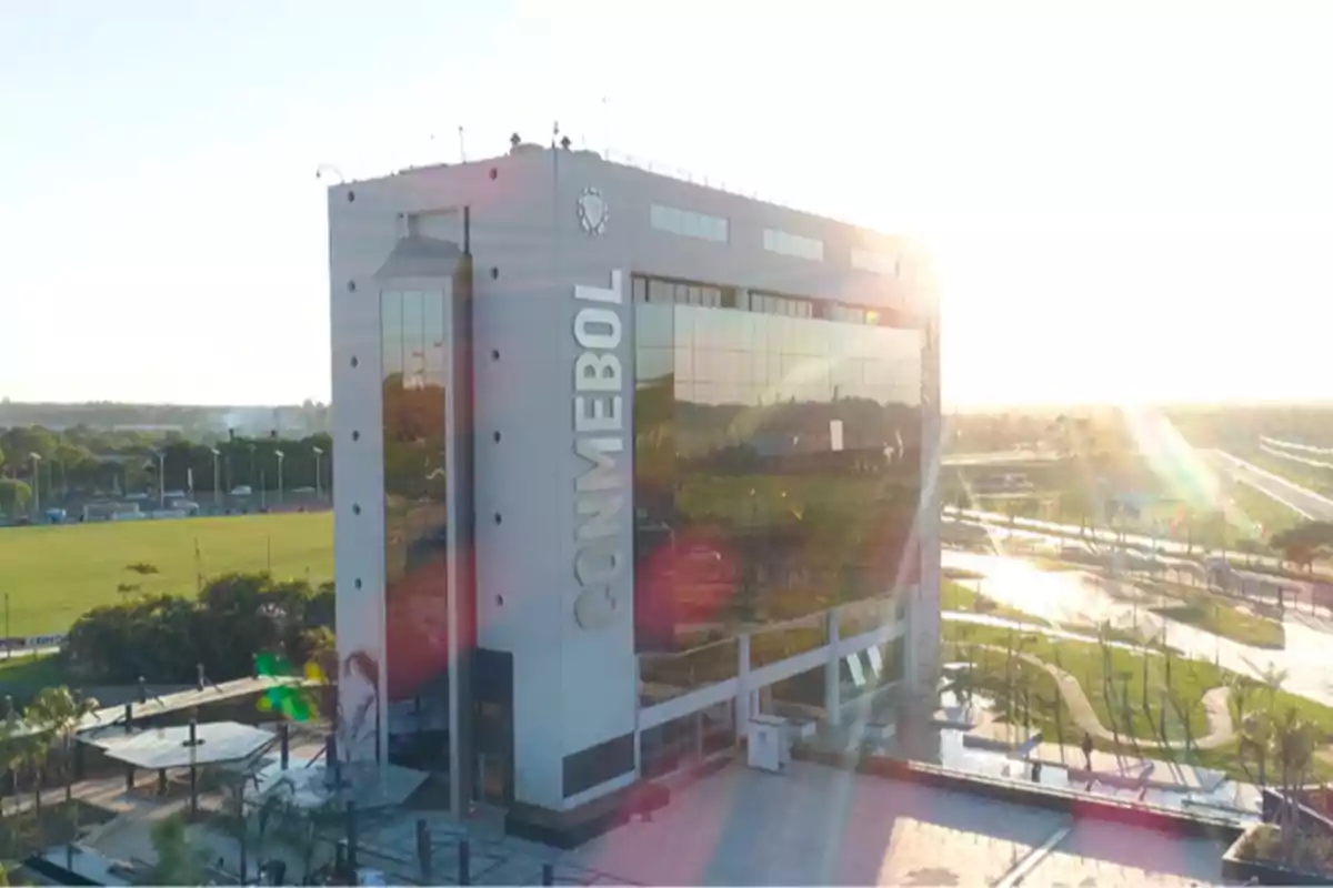 CONMEBOL headquarters building with sunset sunlight reflection and green areas around CONMEBOL headquarters building with sunset sunlight reflection and green areas around