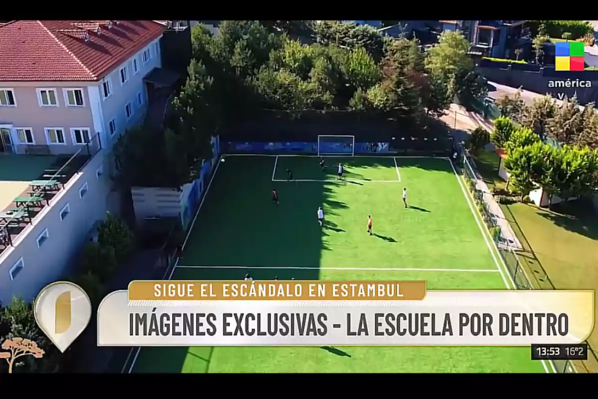 Aerial view of a soccer field at a school surrounded by trees and buildings, with several students playing and a graphic at the bottom indicating exclusive images of a scandal in Istanbul Aerial view of a soccer field at a school surrounded by trees and buildings, with several students playing and a graphic at the bottom indicating exclusive images of a scandal in Istanbul