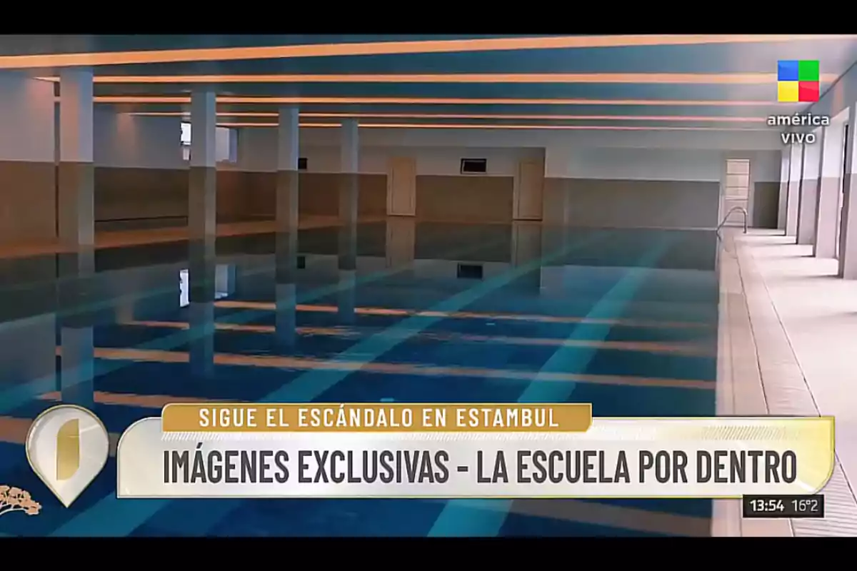 Indoor swimming pool inside a school with white columns and ceiling lights, news footage showing exclusive images of the location Indoor swimming pool inside a school with white columns and ceiling lights, news footage showing exclusive images of the location