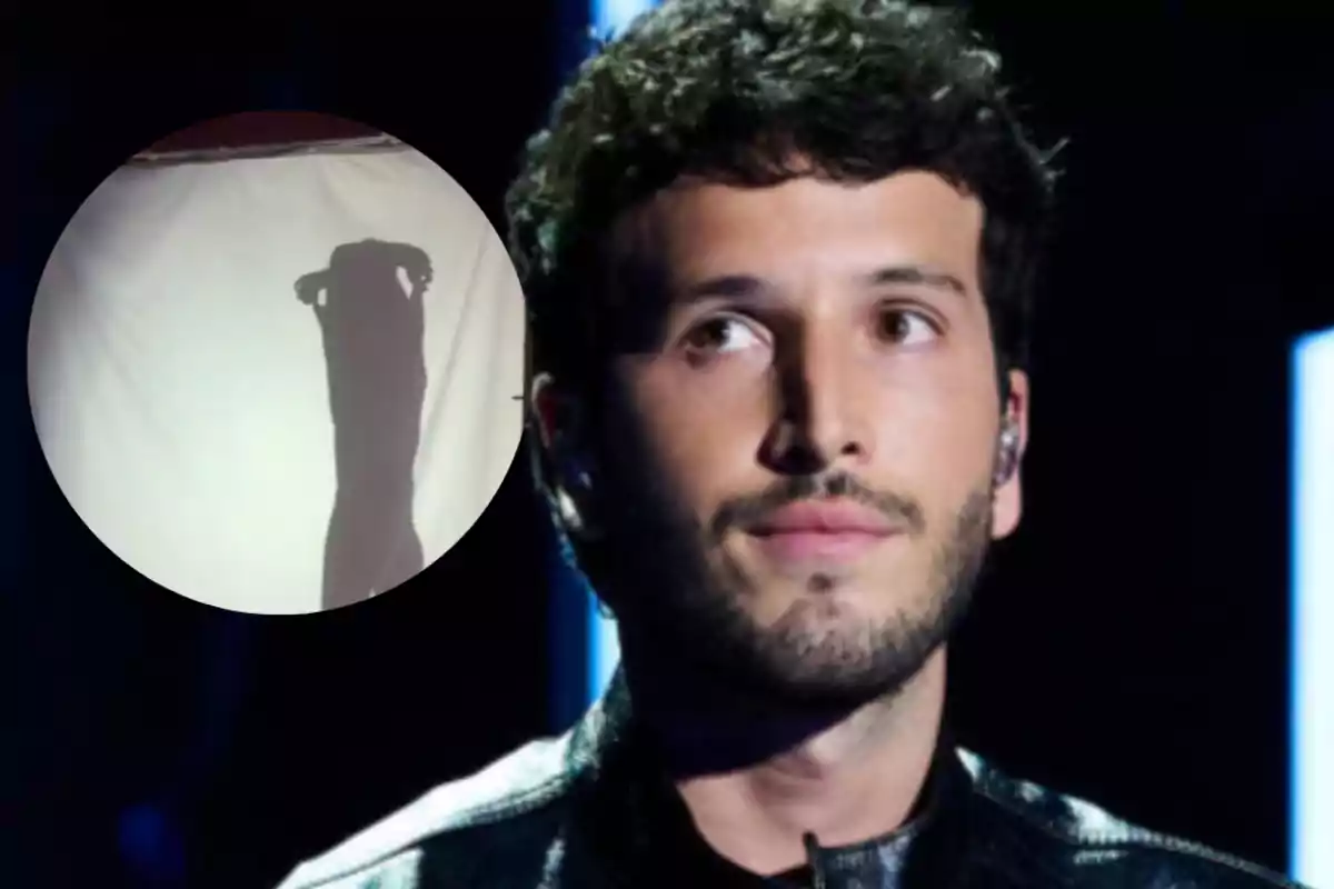 Curly-haired man with a short beard and a serious expression in the foreground, and a circle showing a shadow cast on a white fabric.