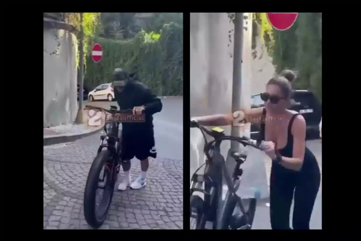 Dos personas empujan bicicletas eléctricas en una calle empedrada junto a señales de tránsito de sentido prohibido Dos personas empujan bicicletas eléctricas en una calle empedrada junto a señales de tránsito de sentido prohibido