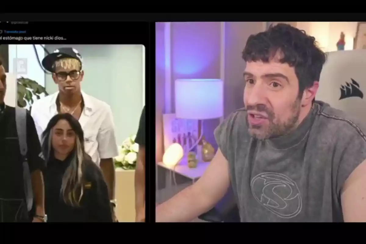 A bearded man in a gray t-jersey reacts in front of a screen showing two people, a woman with long hair and a man wearing glasses and a tilted cap. A bearded man in a gray t-jersey reacts in front of a screen showing two people, a woman with long hair and a man wearing glasses and a tilted cap.