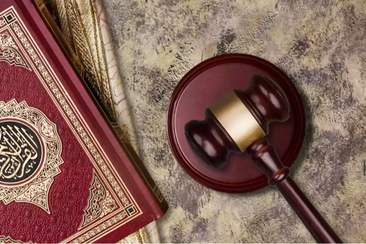 Islamic holy book next to a judge's gavel on a marbled surface Islamic holy book next to a judge's gavel on a marbled surface