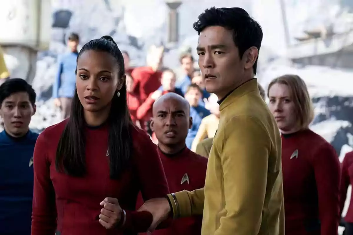 A group of people in colorful uniforms in a futuristic, rocky environment with worried expressions A group of people in colorful uniforms in a futuristic, rocky environment with worried expressions