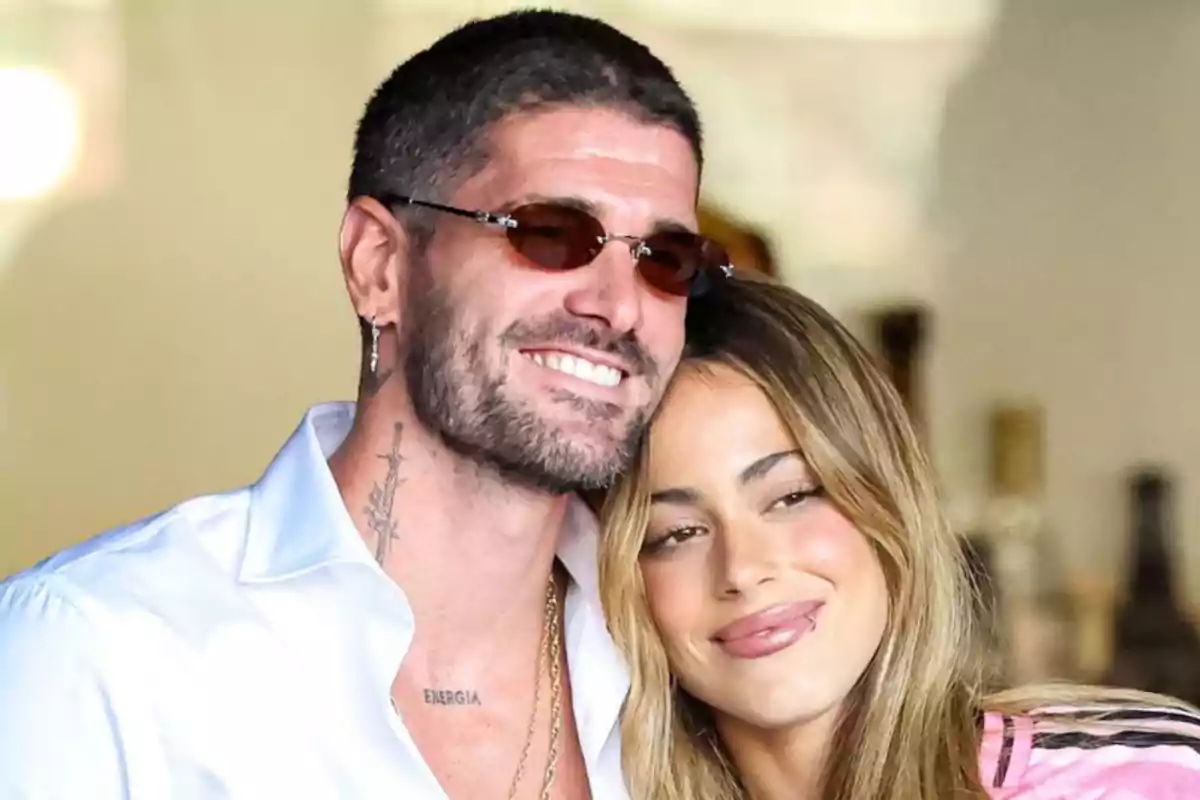Couple hugging and smiling while posing for the photo