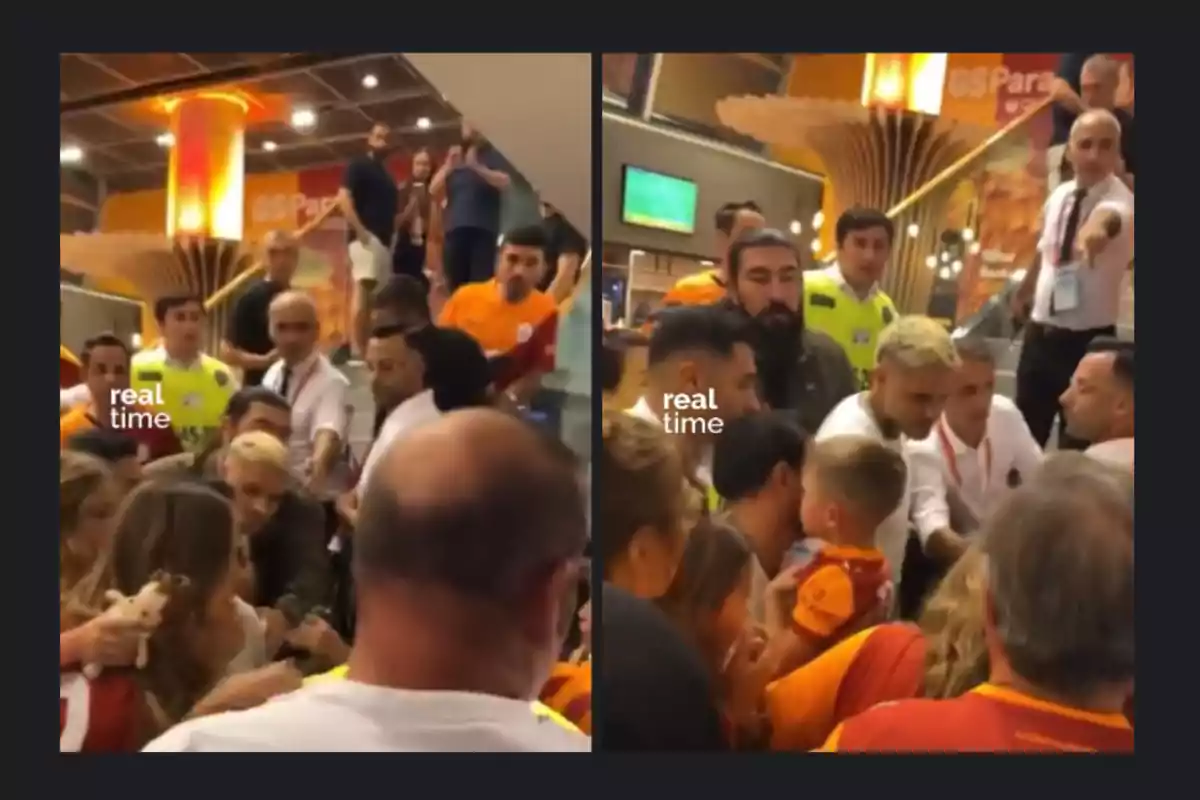 A group of people, some wearing soccer jerseys, gathers inside a building near some stairs, while several security guards and fans interact in a crowded environment. A group of people, some wearing soccer jerseys, gathers inside a building near some stairs, while several security guards and fans interact in a crowded environment.