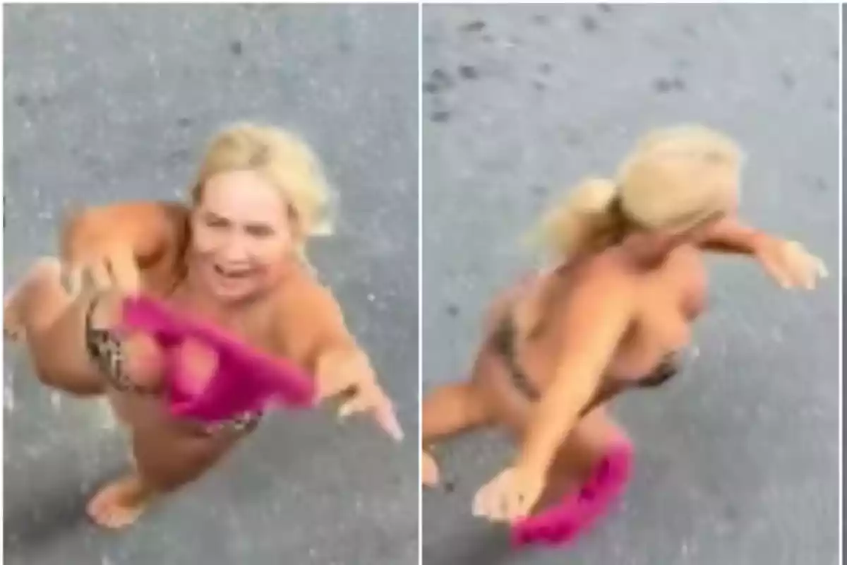 Blonde woman in a bikini with an annoyed expression raising her arms and holding a pink garment in the street Blonde woman in a bikini with an annoyed expression raising her arms and holding a pink garment in the street