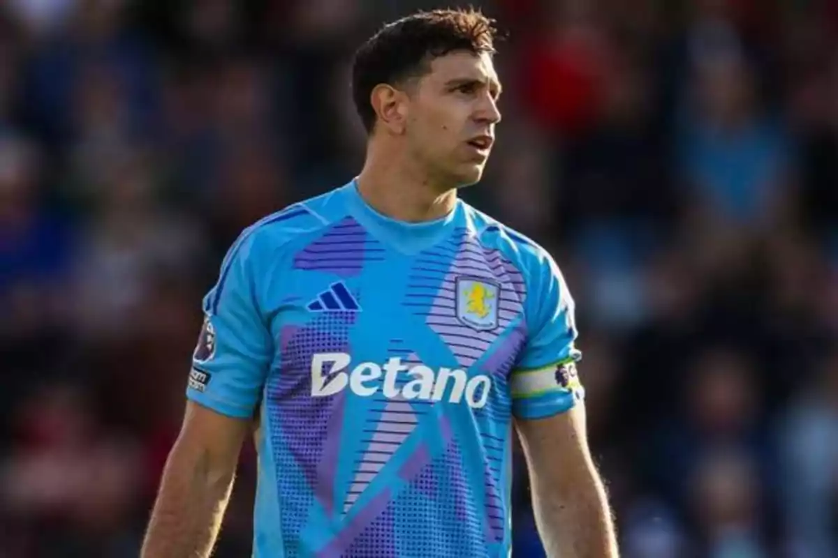 Aston Villa soccer goalkeeper wearing a sky blue and purple uniform during a match