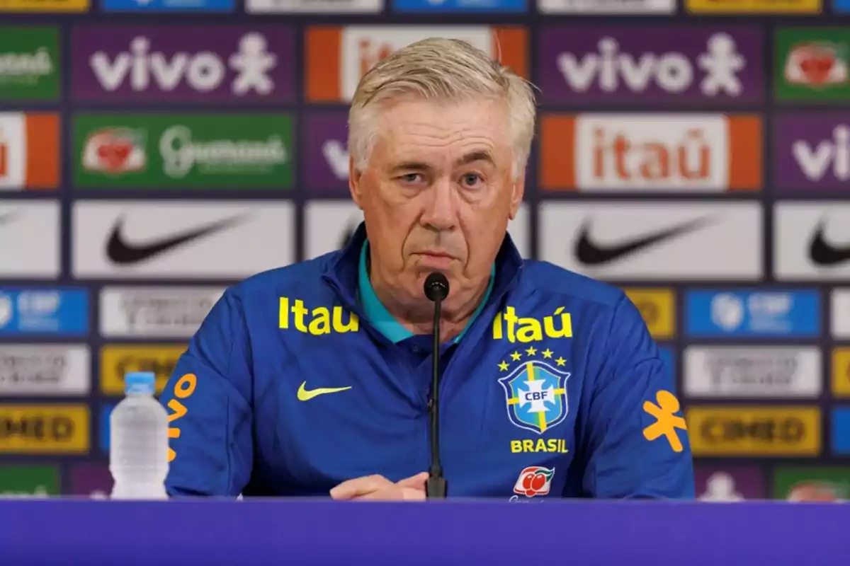 Coach of the Brazil national soccer team at a press conference with a sponsor backdrop and a microphone in front of him Coach of the Brazil national soccer team at a press conference with a sponsor backdrop and a microphone in front of him