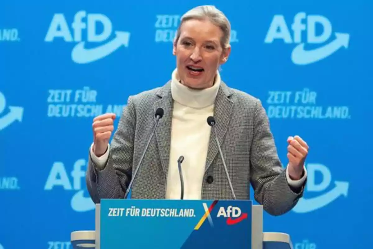 Woman speaking at a podium with a blue background and AfD logos Woman speaking at a podium with a blue background and AfD logos