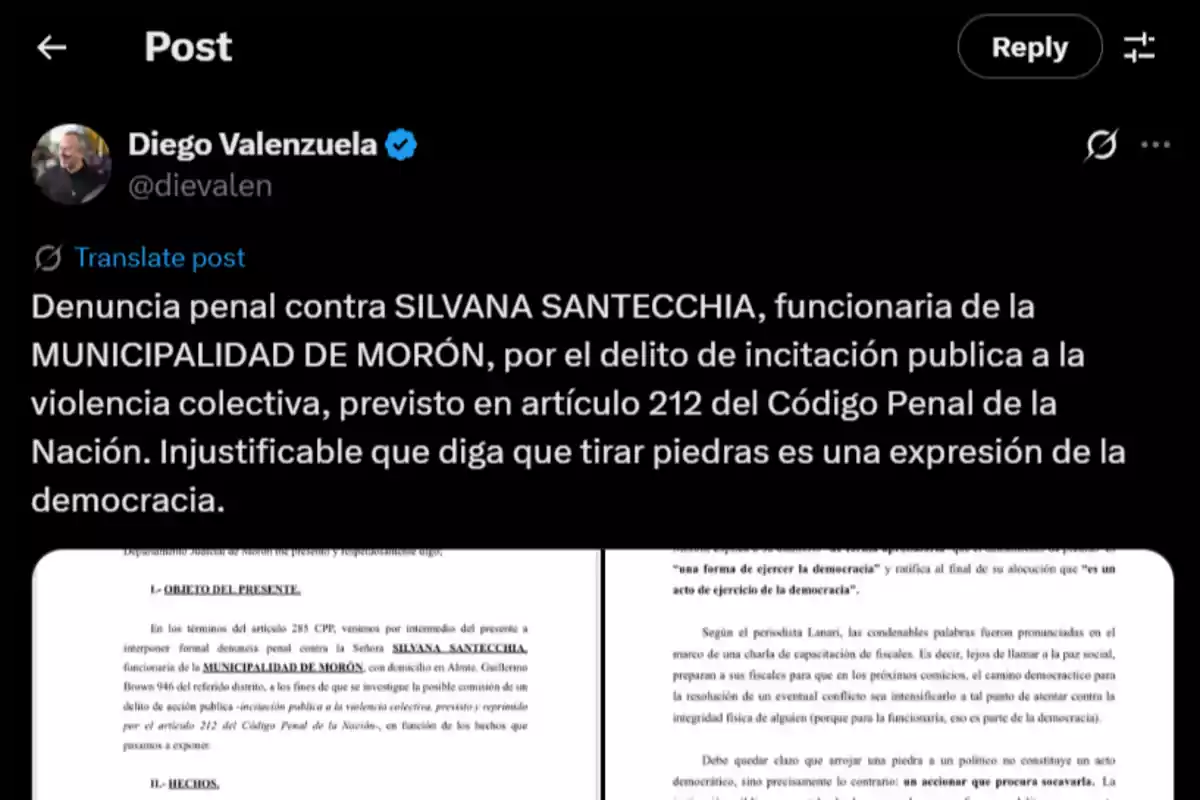 Twitter post by Diego Valenzuela reporting a criminal complaint against Silvana Santecchia, an official of the Municipality of Morón, for public incitement to collective violence, and criticizing the justification of throwing stones as a democratic expression, accompanied by an image of a legal document. Twitter post by Diego Valenzuela reporting a criminal complaint against Silvana Santecchia, an official of the Municipality of Morón, for public incitement to collective violence, and criticizing the justification of throwing stones as a democratic expression, accompanied by an image of a legal document.