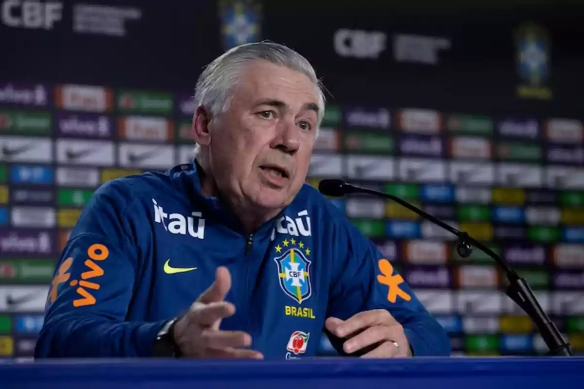 Soccer coach wearing a Brazil national team jacket speaking at a press conference in front of a microphone Soccer coach wearing a Brazil national team jacket speaking at a press conference in front of a microphone