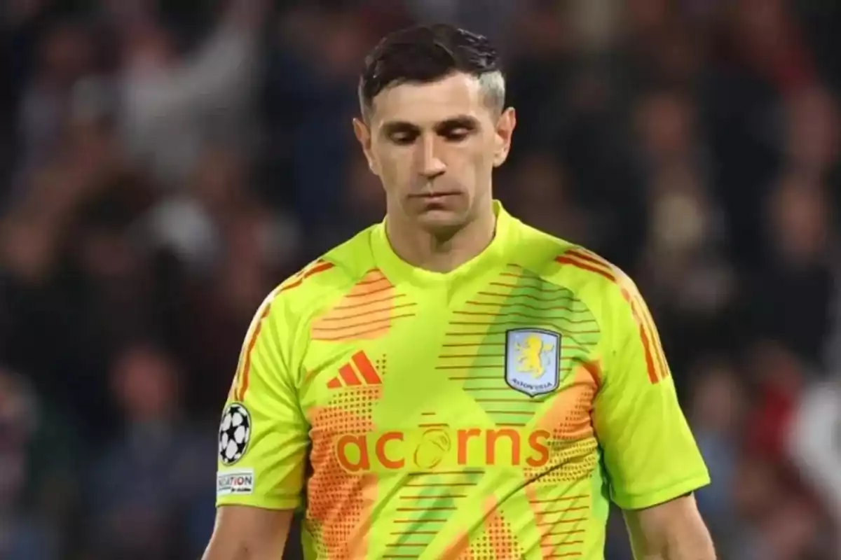 Aston Villa soccer goalkeeper in a fluorescent green uniform in a stadium Aston Villa soccer goalkeeper in a fluorescent green uniform in a stadium