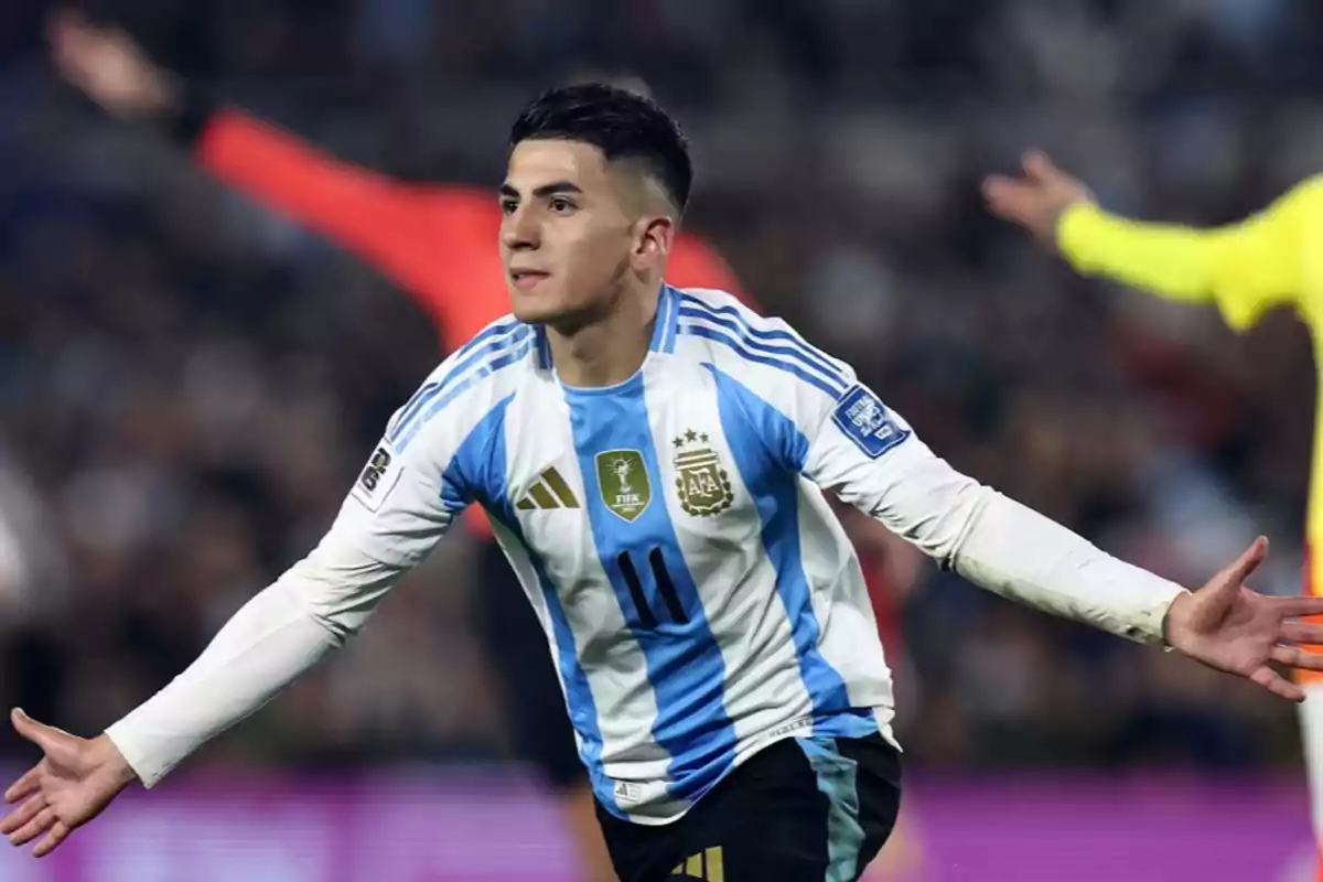 Argentinian player celebrating a goal with arms outstretched during a match Argentinian player celebrating a goal with arms outstretched during a match