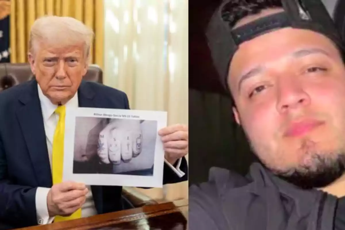 Un hombre de cabello rubio y traje oscuro sostiene una hoja con una imagen en blanco y negro mientras está sentado en una oficina elegante junto a la foto de un joven con gorra negra y barba recortada