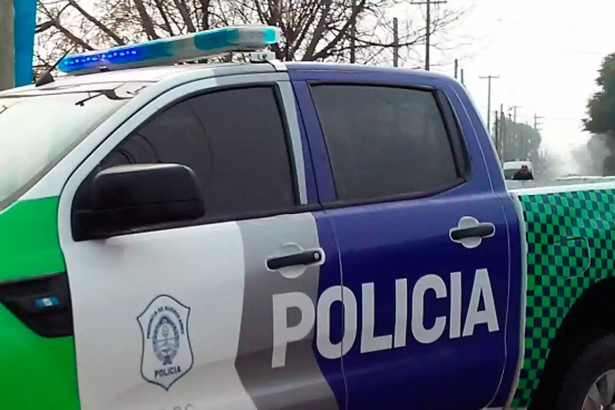 Police pickup truck with green, white, and blue colors parked on a street Police pickup truck with green, white, and blue colors parked on a street