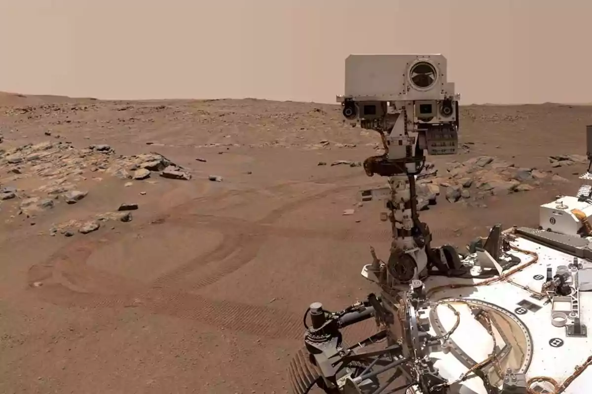 Rover exploring the rocky and sandy surface of Mars under a reddish sky Rover exploring the rocky and sandy surface of Mars under a reddish sky