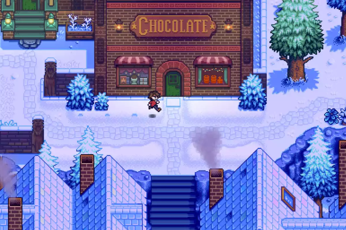 Una persona camina frente a una tienda de chocolate en un pueblo cubierto de nieve con árboles y casas alrededor Una persona camina frente a una tienda de chocolate en un pueblo cubierto de nieve con árboles y casas alrededor