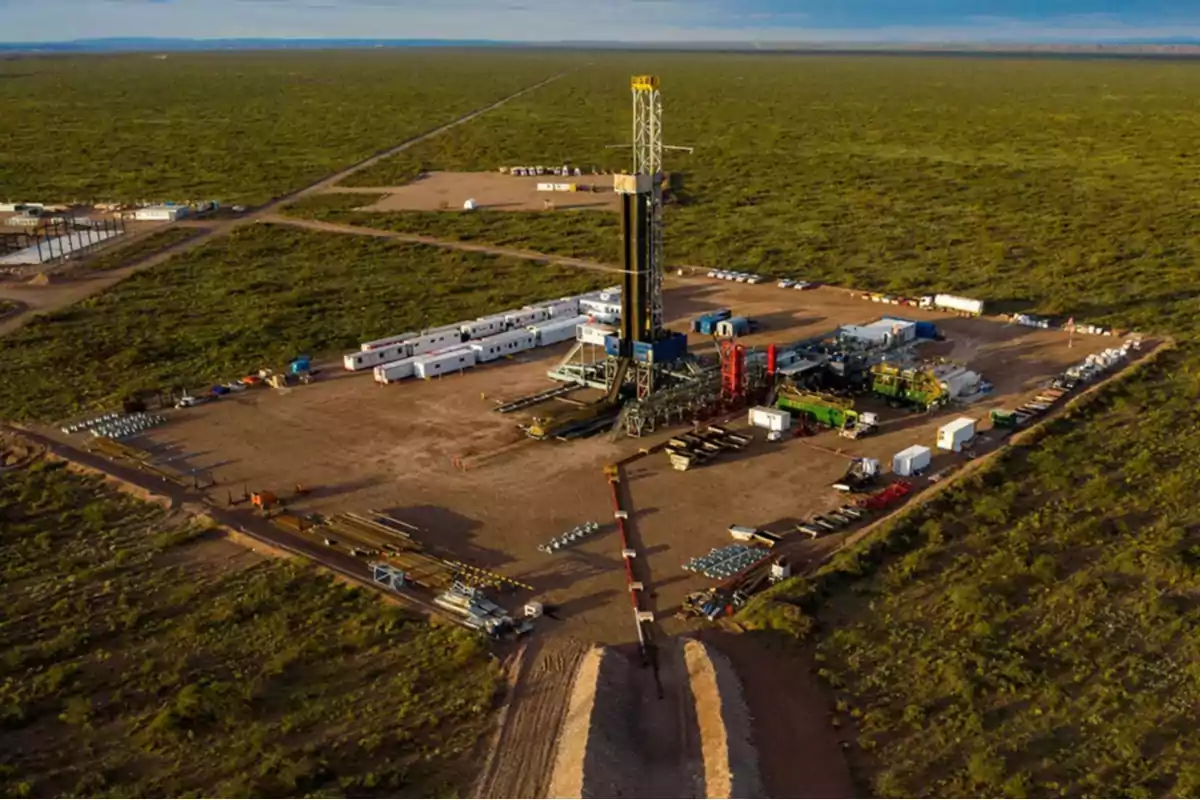 Aerial view of an oil platform surrounded by vegetation in a rural area