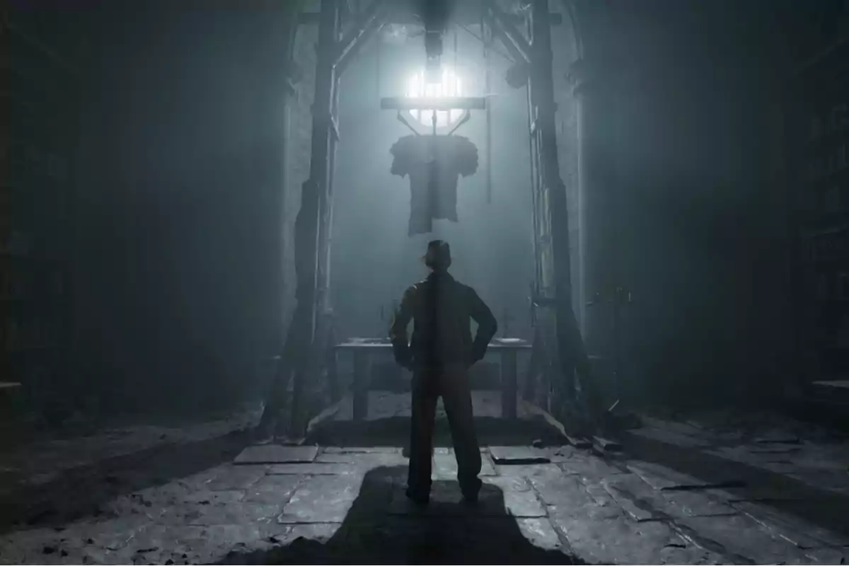A man with his back turned, wearing a hat, watches a figure hanging in the center of a dark, old room illuminated by an intense light from above. A man with his back turned, wearing a hat, watches a figure hanging in the center of a dark, old room illuminated by an intense light from above.