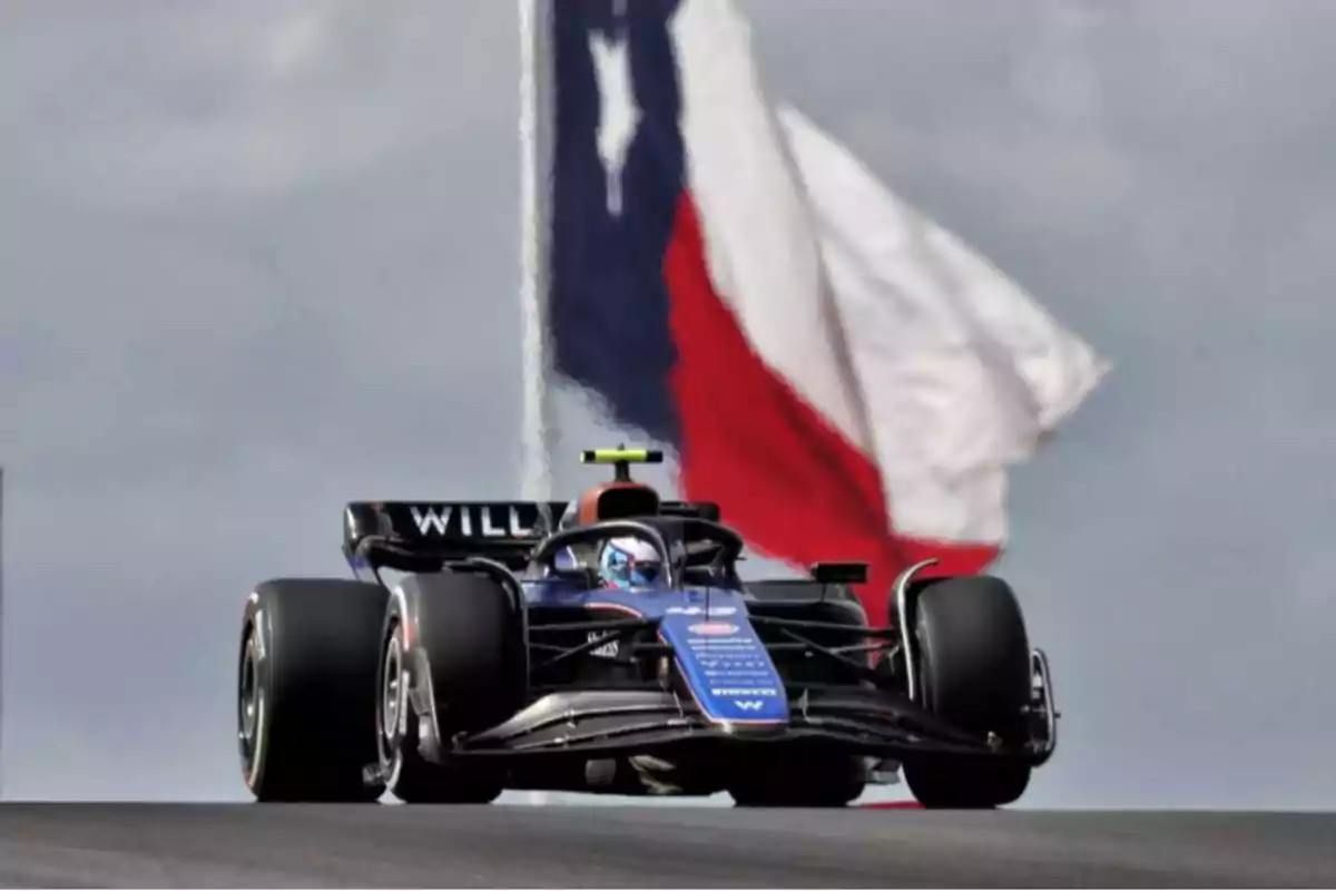 A moving race car with a large flag in the background. A moving race car with a large flag in the background.