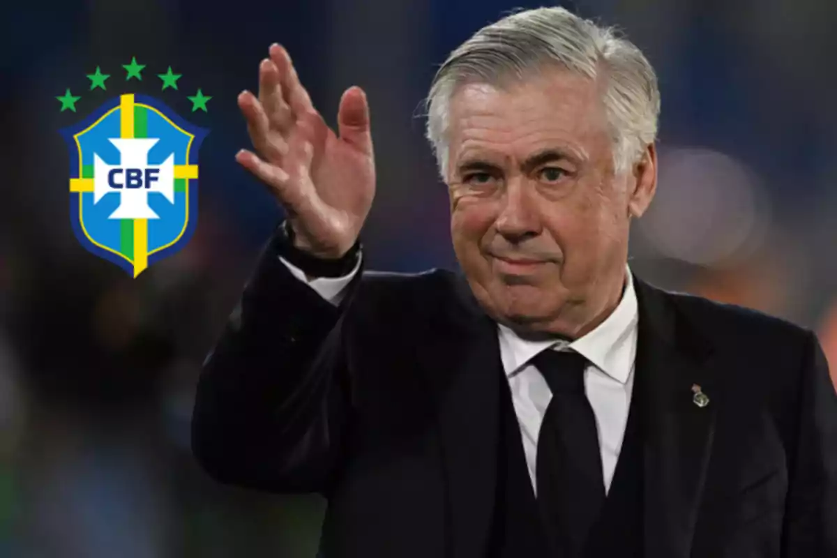 Un hombre de traje oscuro levanta la mano mientras el escudo de la Confederación Brasileña de Fútbol aparece a su lado.