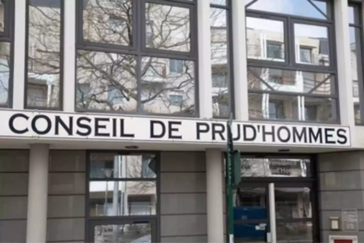 Facade of a building with a large sign that says Conseil de Prud'hommes Facade of a building with a large sign that says Conseil de Prud'hommes