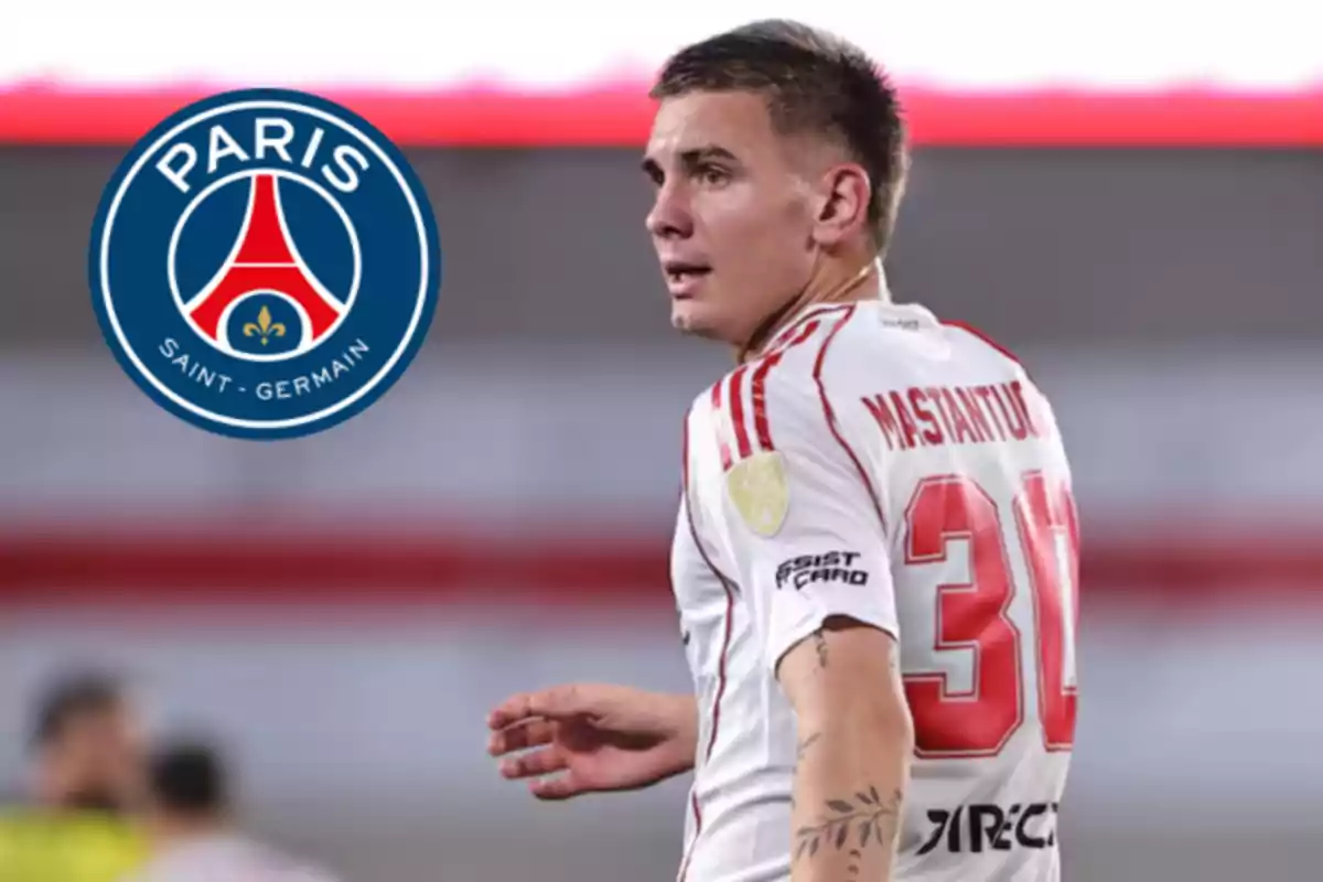 Soccer player with white and red jersey number 30 on the field with the Paris Saint-Germain logo in the background.