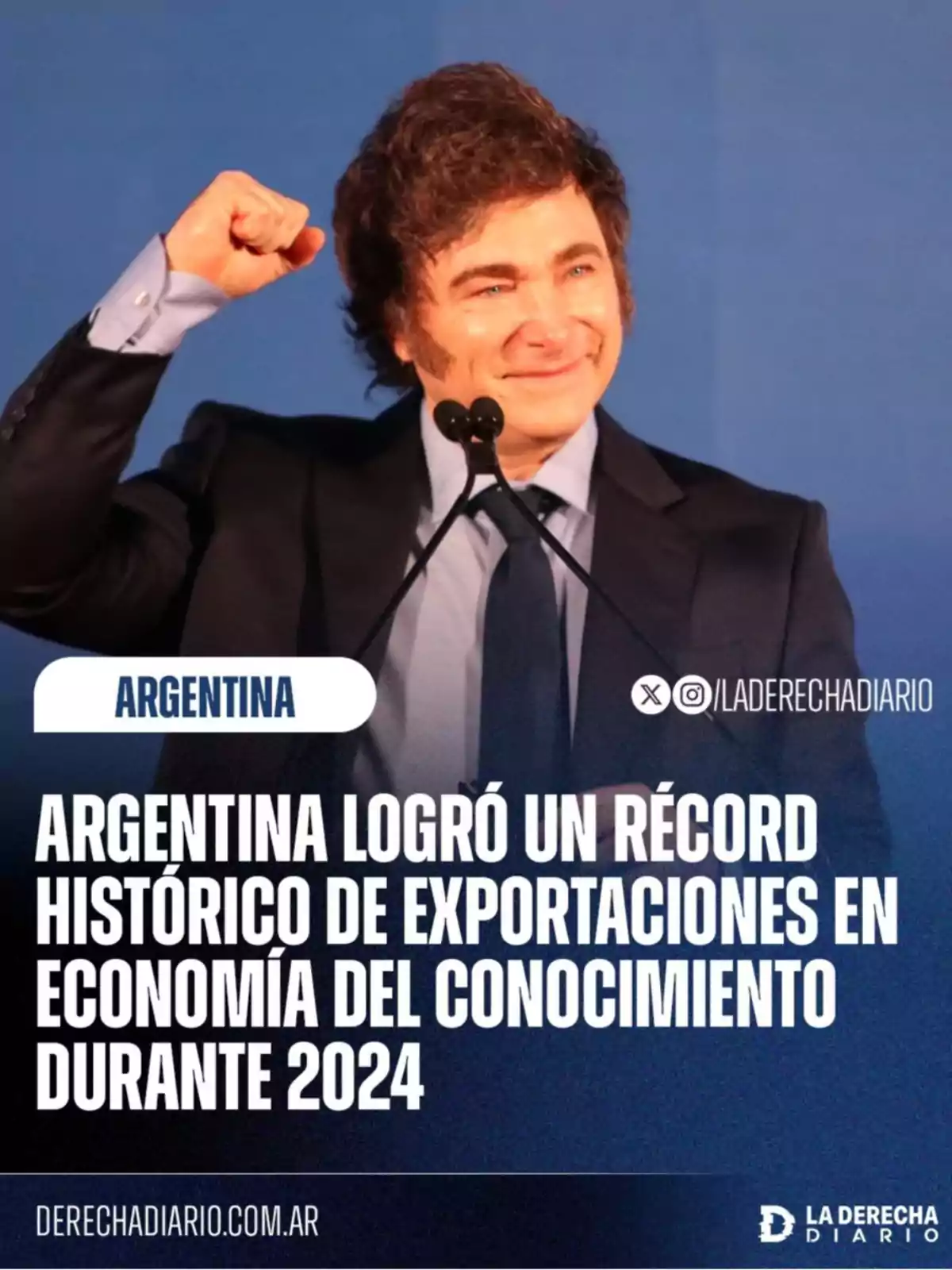 Smiling man in a suit raising his fist in front of a microphone with a sign announcing a historic record of knowledge economy exports in Argentina during 2024 Smiling man in a suit raising his fist in front of a microphone with a sign announcing a historic record of knowledge economy exports in Argentina during 2024