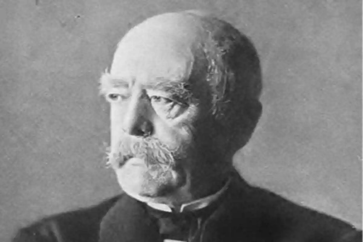Black and white portrait of an older man with a mustache and a serious expression looking to the left Black and white portrait of an older man with a mustache and a serious expression looking to the left