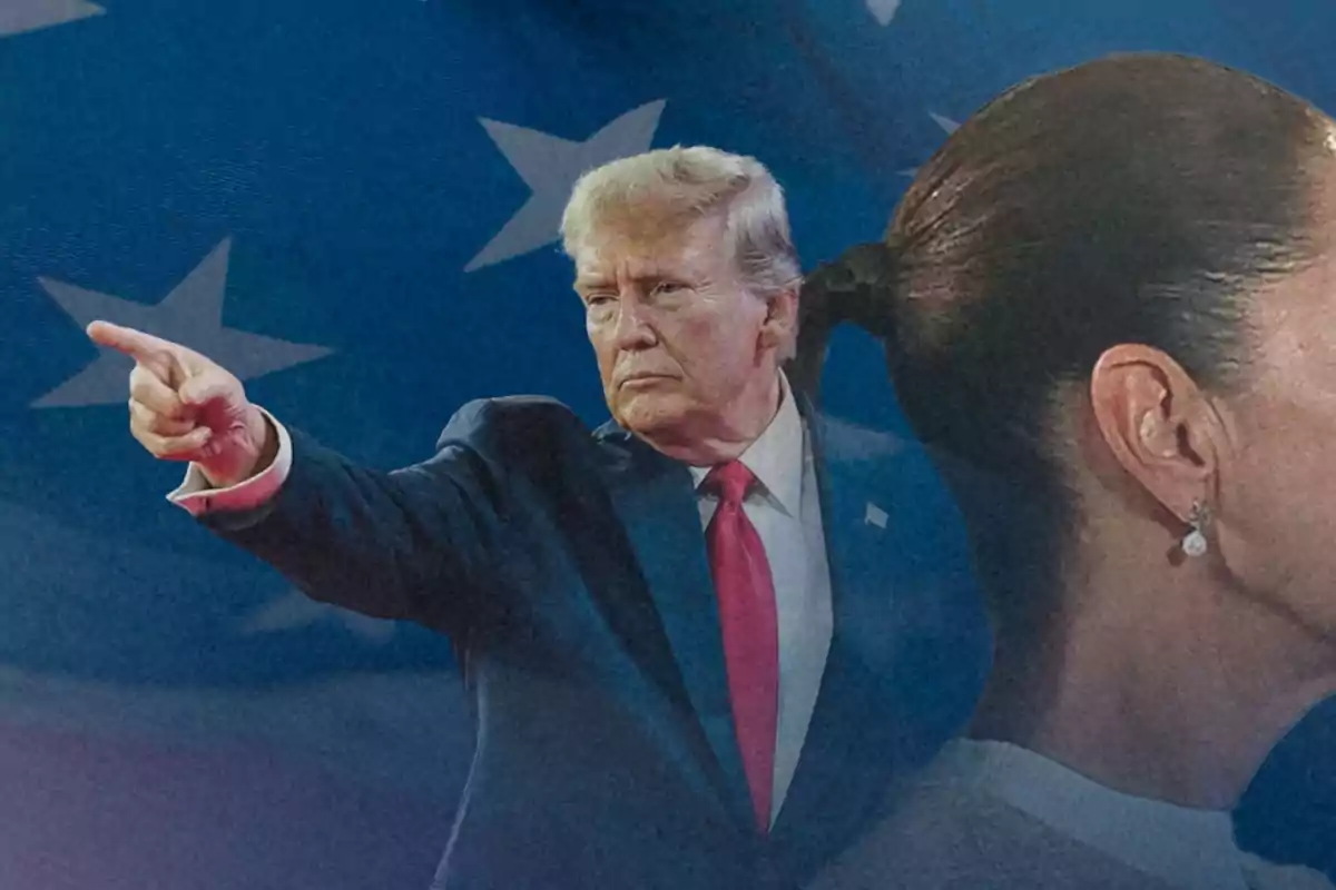 A man in a dark suit and red tie points with his finger while a woman with her hair up stands with her back turned, with a flag in the background.