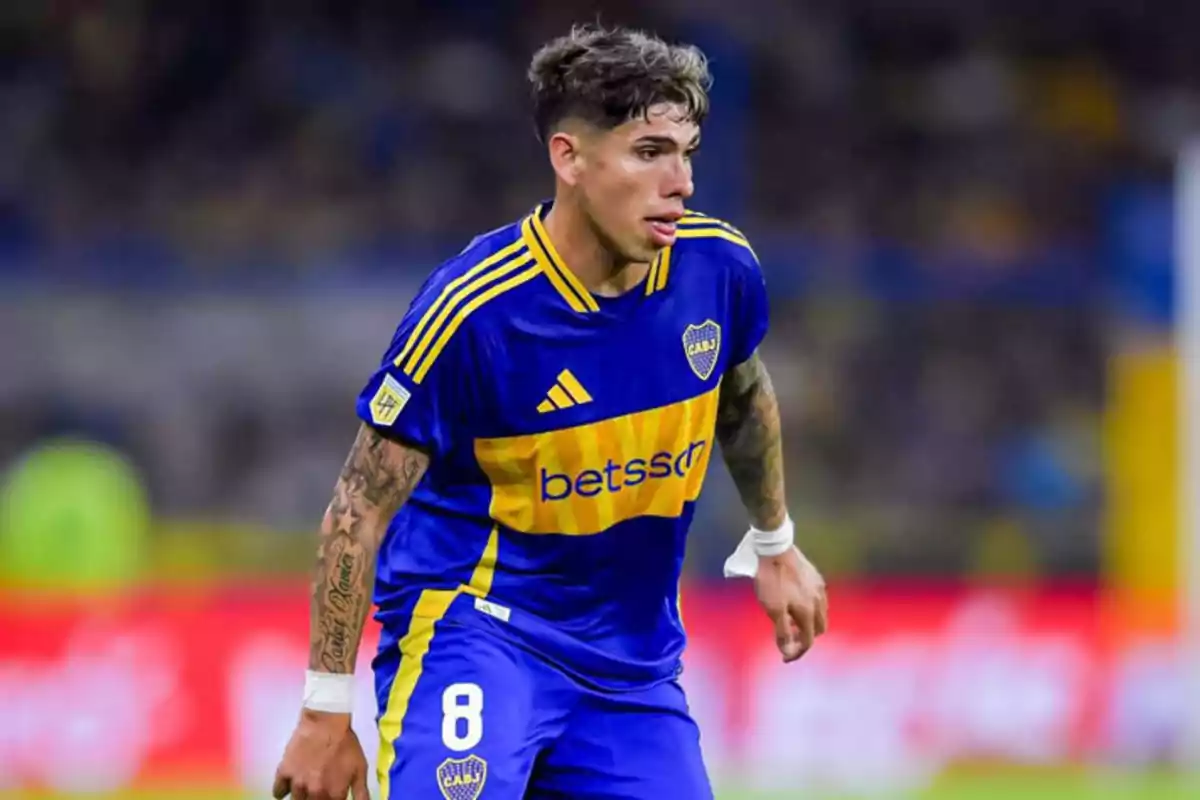 Soccer player in blue and yellow uniform on the playing field. Soccer player in blue and yellow uniform on the playing field.