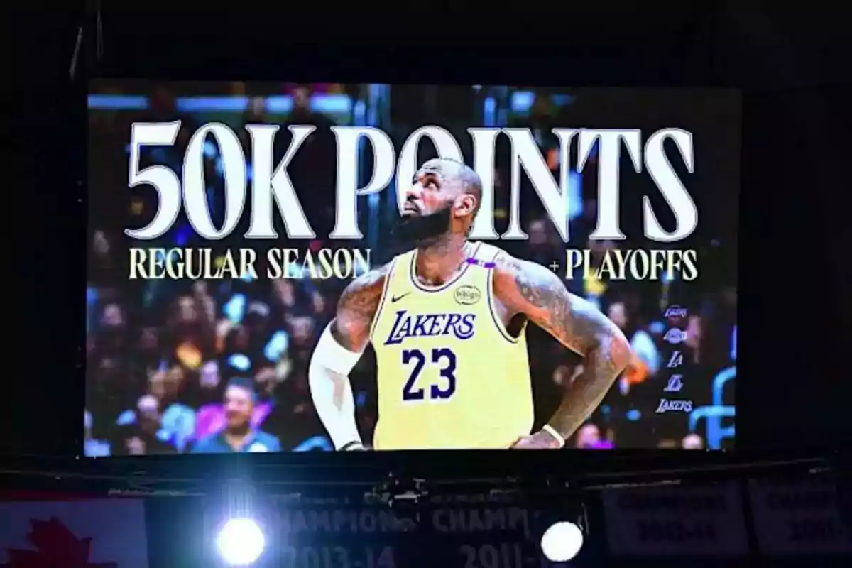 Basketball player in a Lakers jersey on a screen celebrating 50,000 points in regular season and play-offs. Basketball player in a Lakers jersey on a screen celebrating 50,000 points in regular season and play-offs.