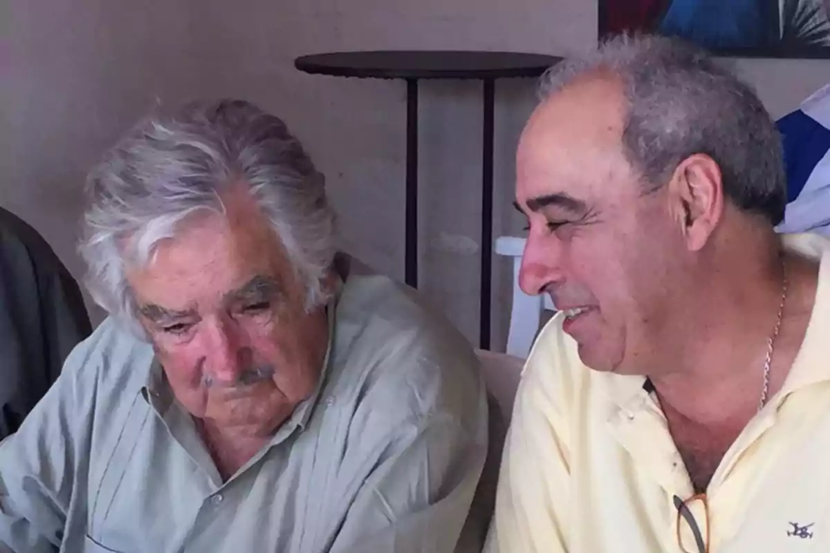 Two men talking in an indoor setting. Two men talking in an indoor setting.