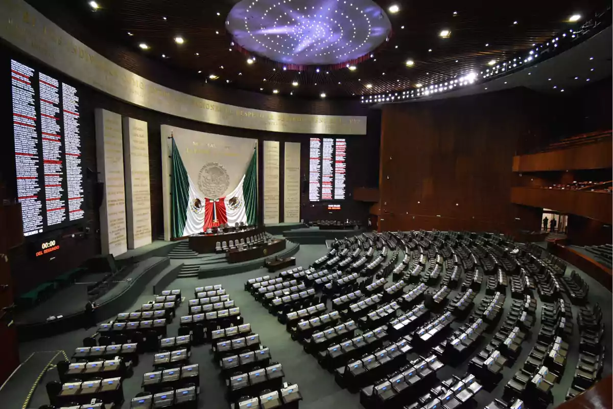 Interior of a large assembly hall with seats arranged in a semicircle and a large flag in the center. Interior of a large assembly hall with seats arranged in a semicircle and a large flag in the center.