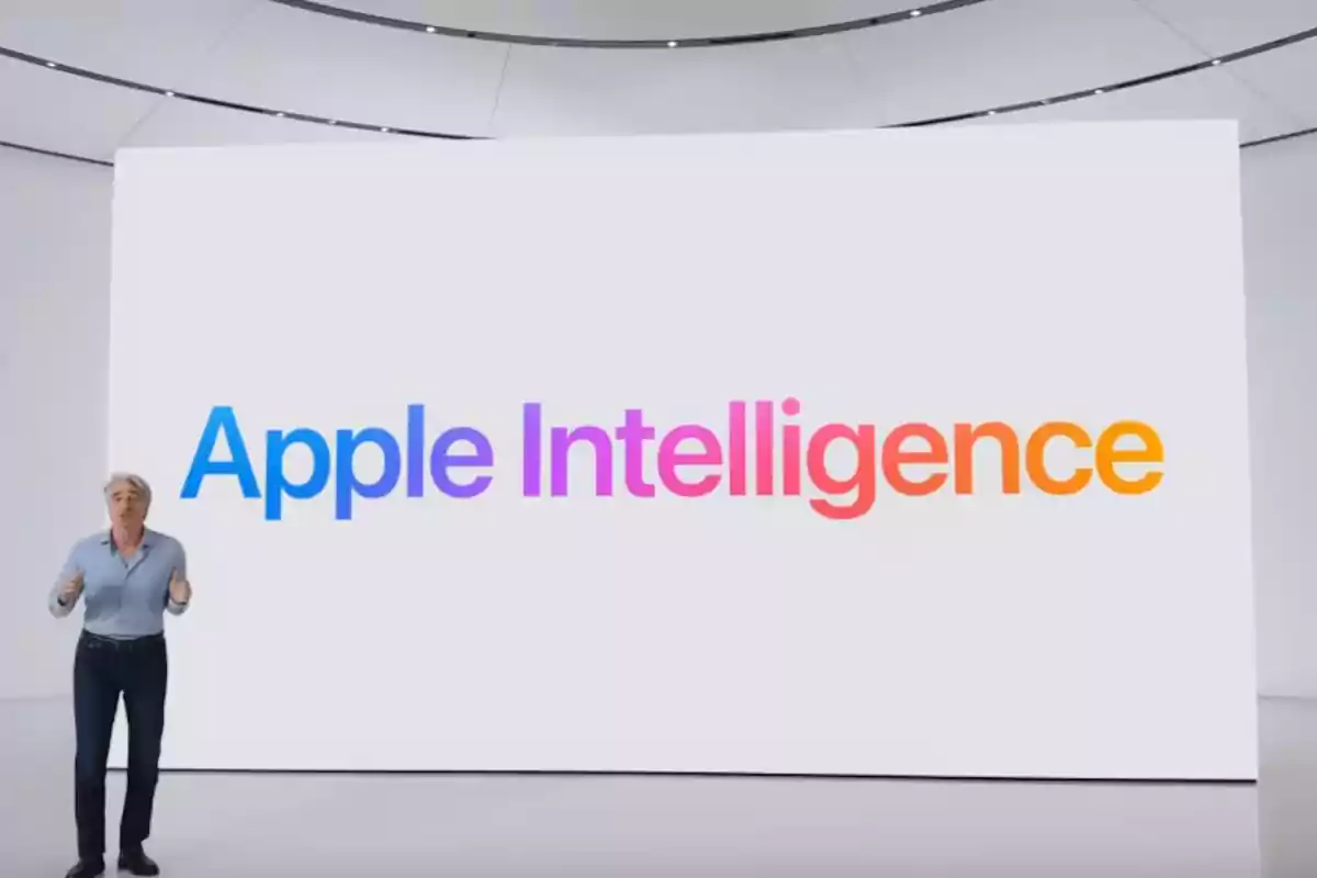 Persona presentando frente a una pantalla grande que muestra el texto Apple Intelligence en colores degradados Persona presentando frente a una pantalla grande que muestra el texto Apple Intelligence en colores degradados